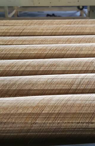 A hose is spiraled with brass coated wires.